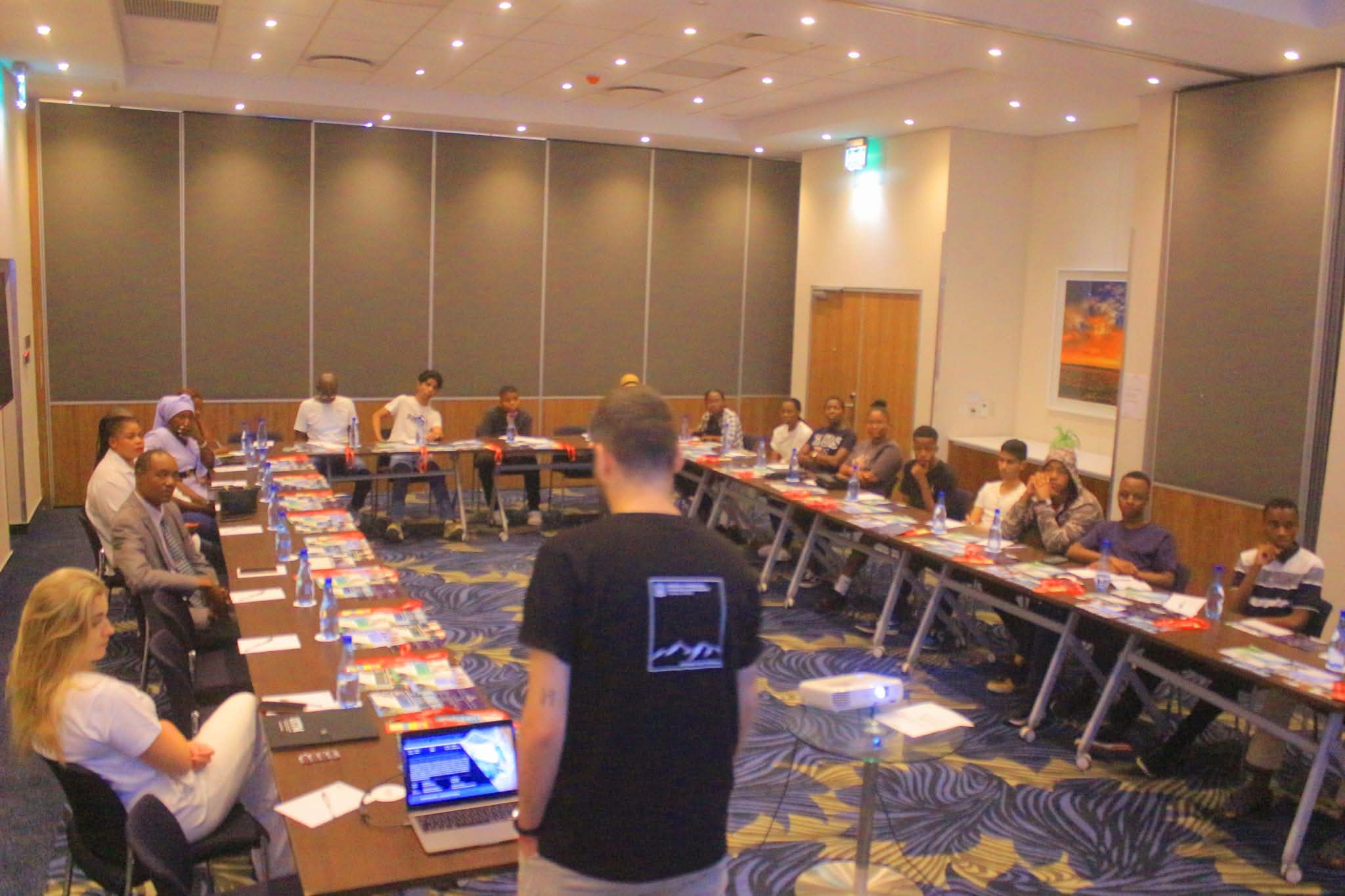 A Dentcor study-abroad seminar in progress with students seated around the room